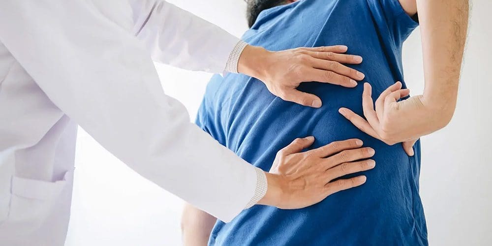 A chiropractor is assessing a patient's lower back pain.