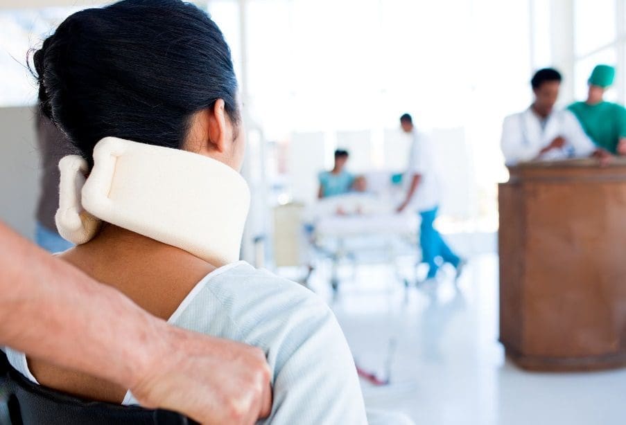 A woman in a neck brace.