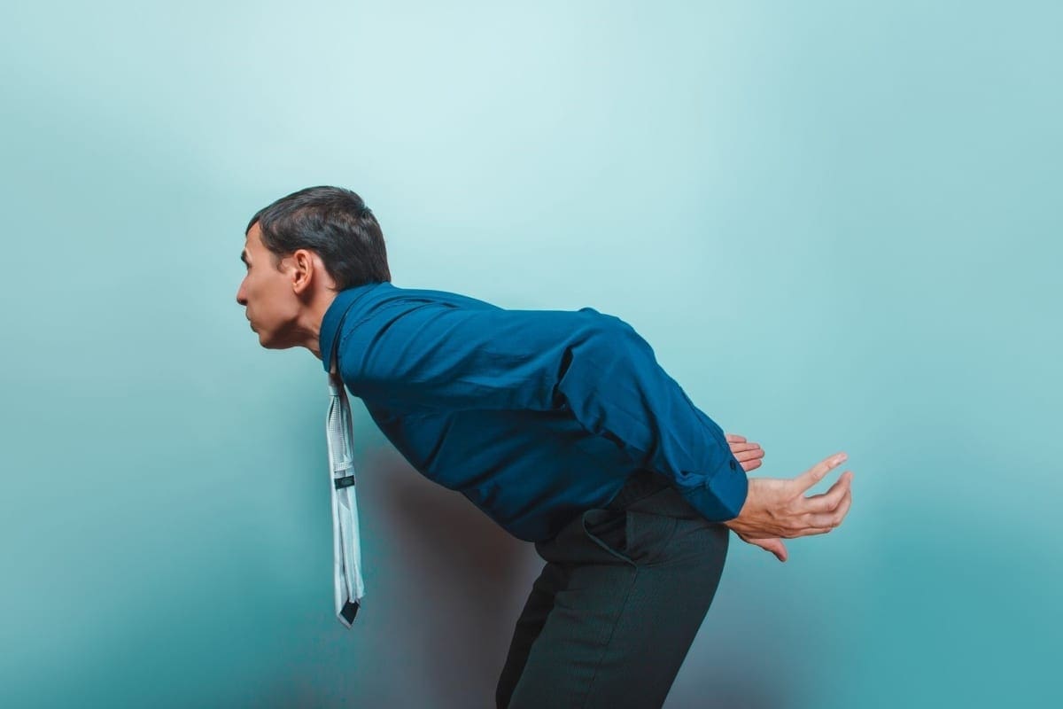 A man cannot stand up straight because of sciatica.
