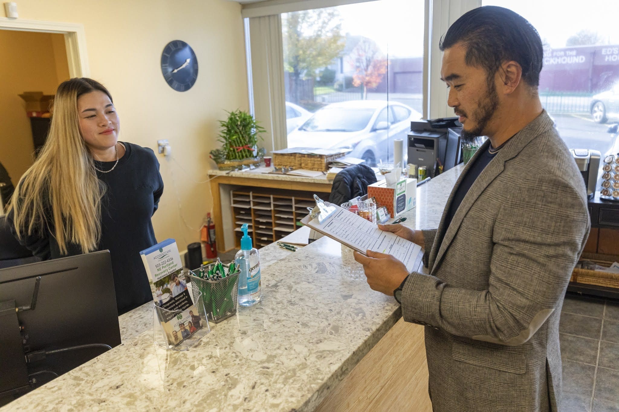 A patient checks in at SE Portland Accident Care Chiropractic.