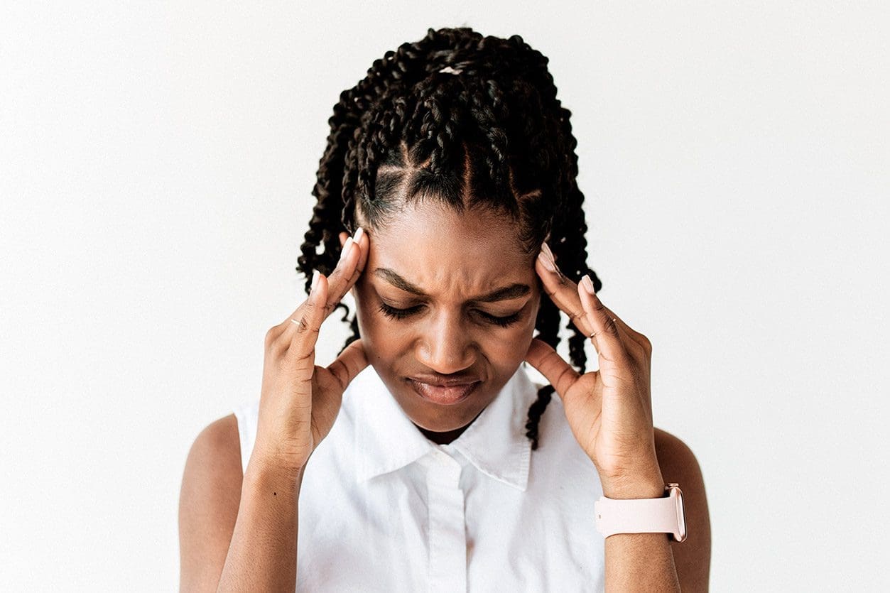 A woman looking very stressed.