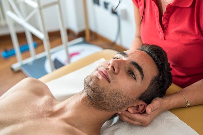 A man is being evaluated for concussion therapy.