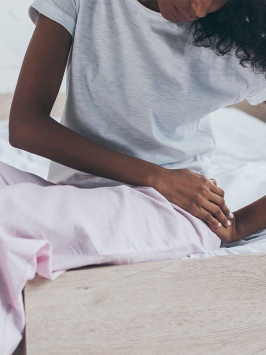 A woman is suffering from hip pain.