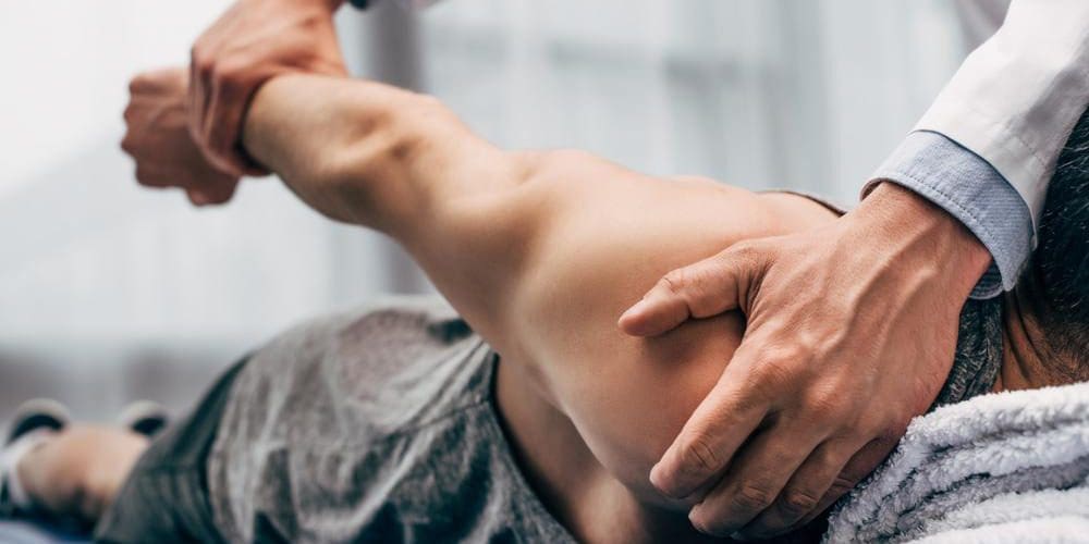 A woman is getting a chiropractic adjustment for poor circulation.