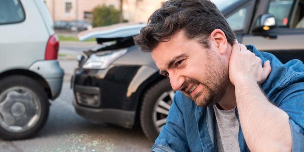 A man is suffering from bursitis after a car accident.