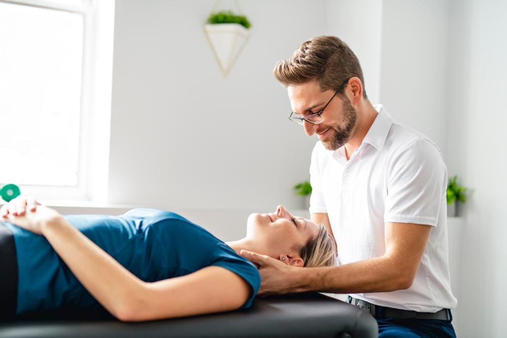 A chiropractor is administering treatment for brain injury symptoms. 