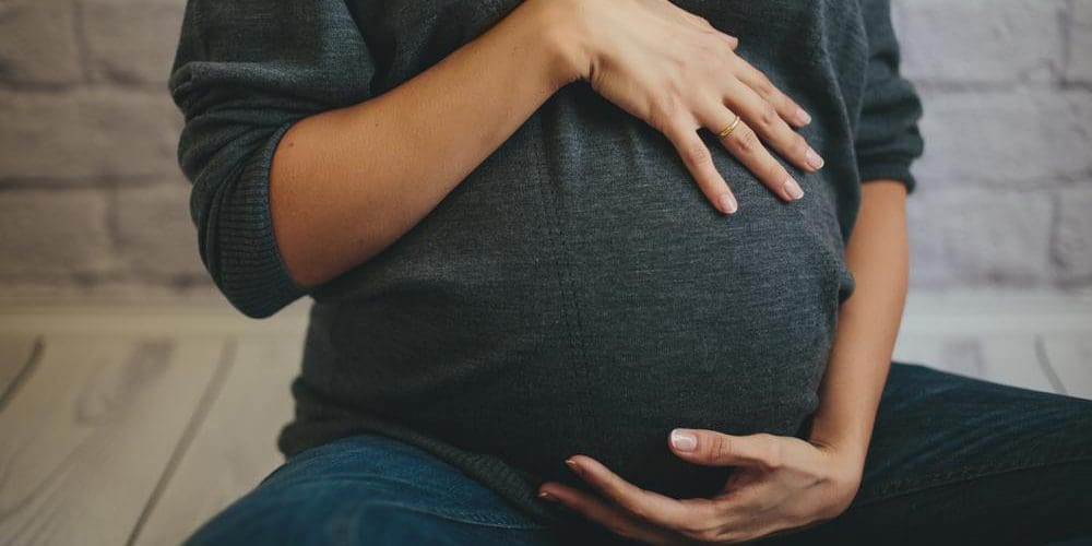 A pregnant woman.