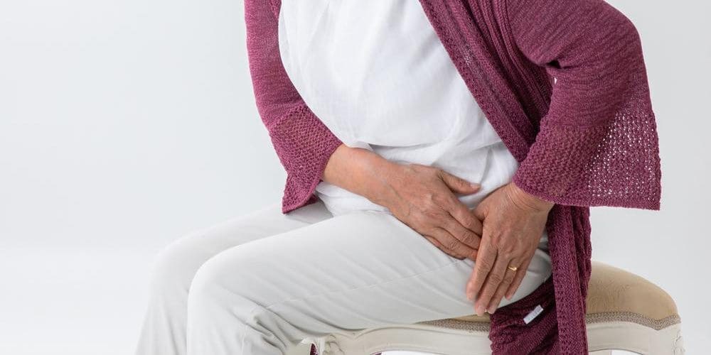 A woman is in pain and having trouble standing because of a torn hip labrum.