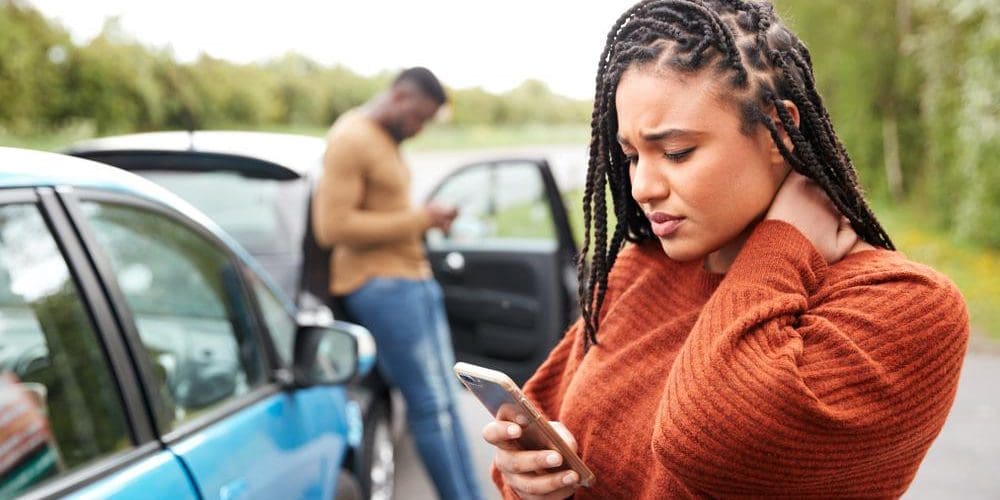 A woman is distressed after a car accident.
