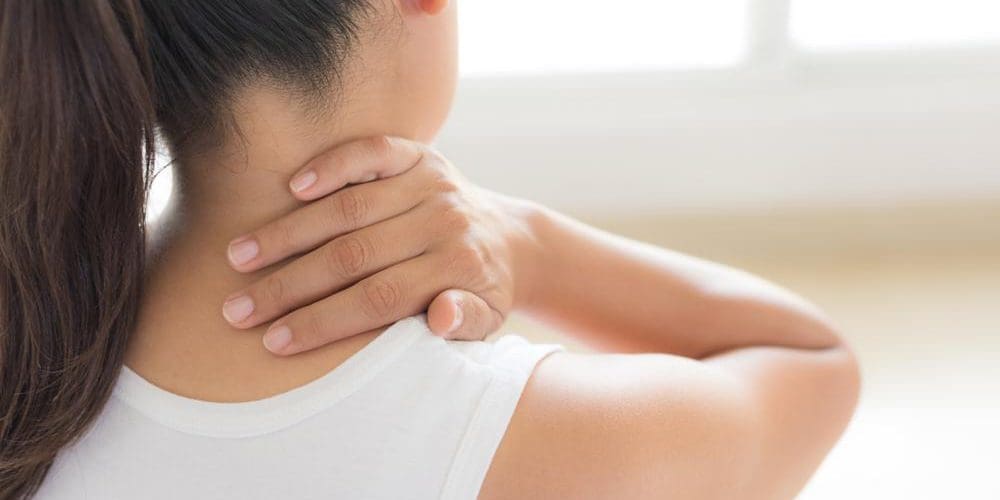 A woman is suffering from a herniated disc in her neck.