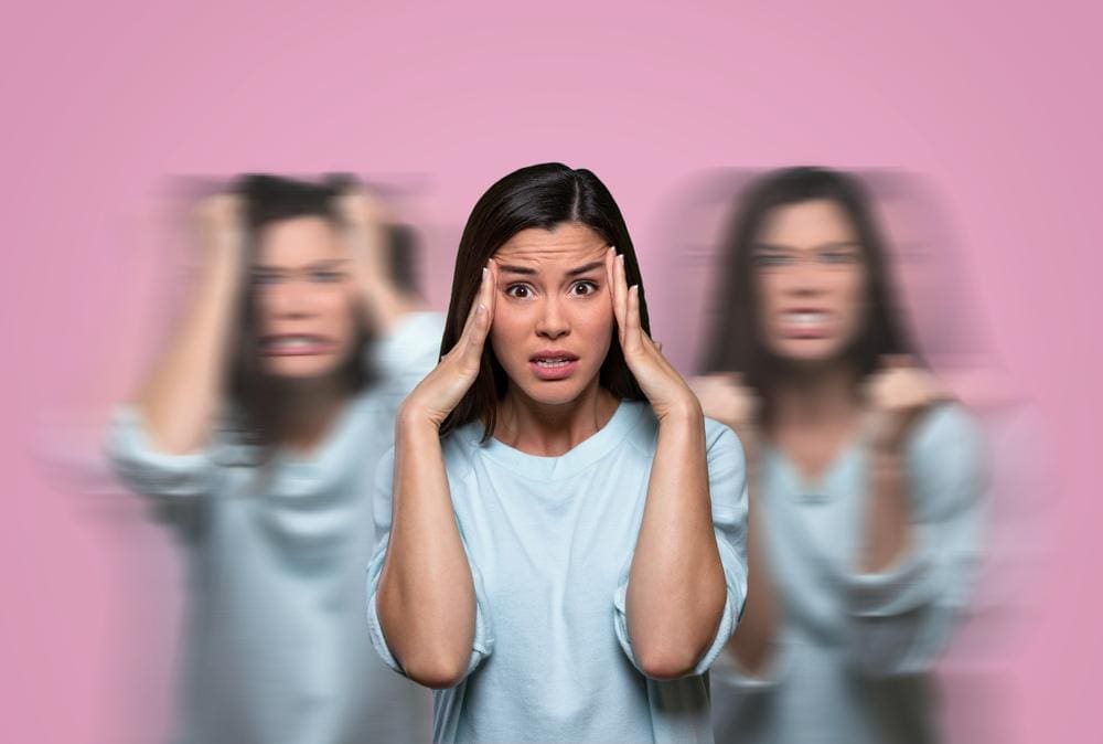 A woman is suffering from headaches and other PMS symptoms. 