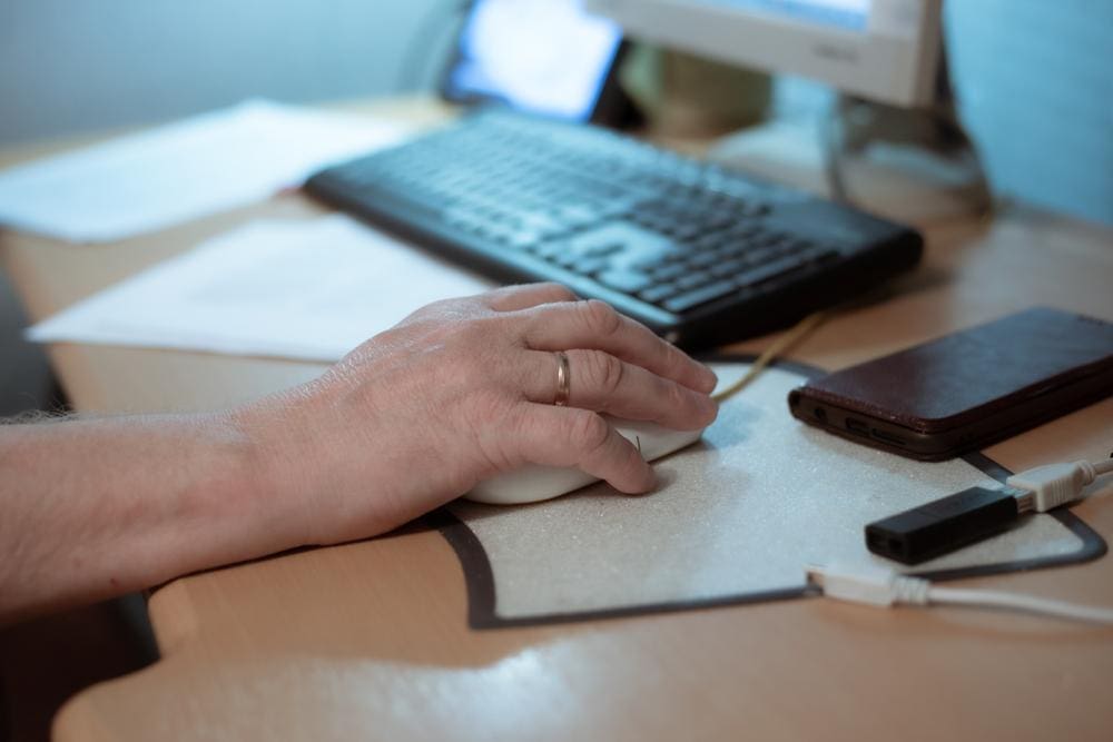 A person using a computer mouse.