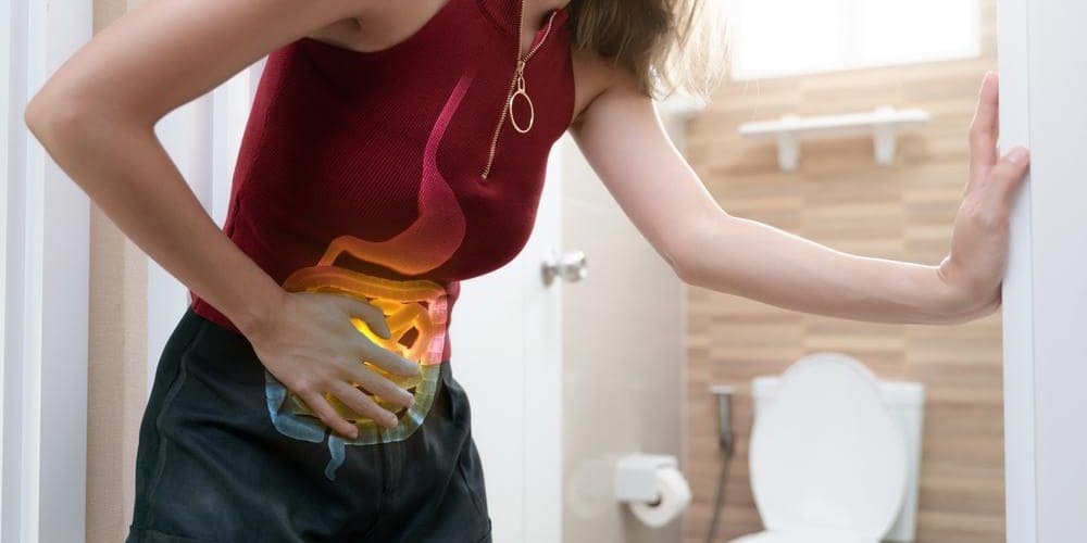 A woman is in pain because of constipation.