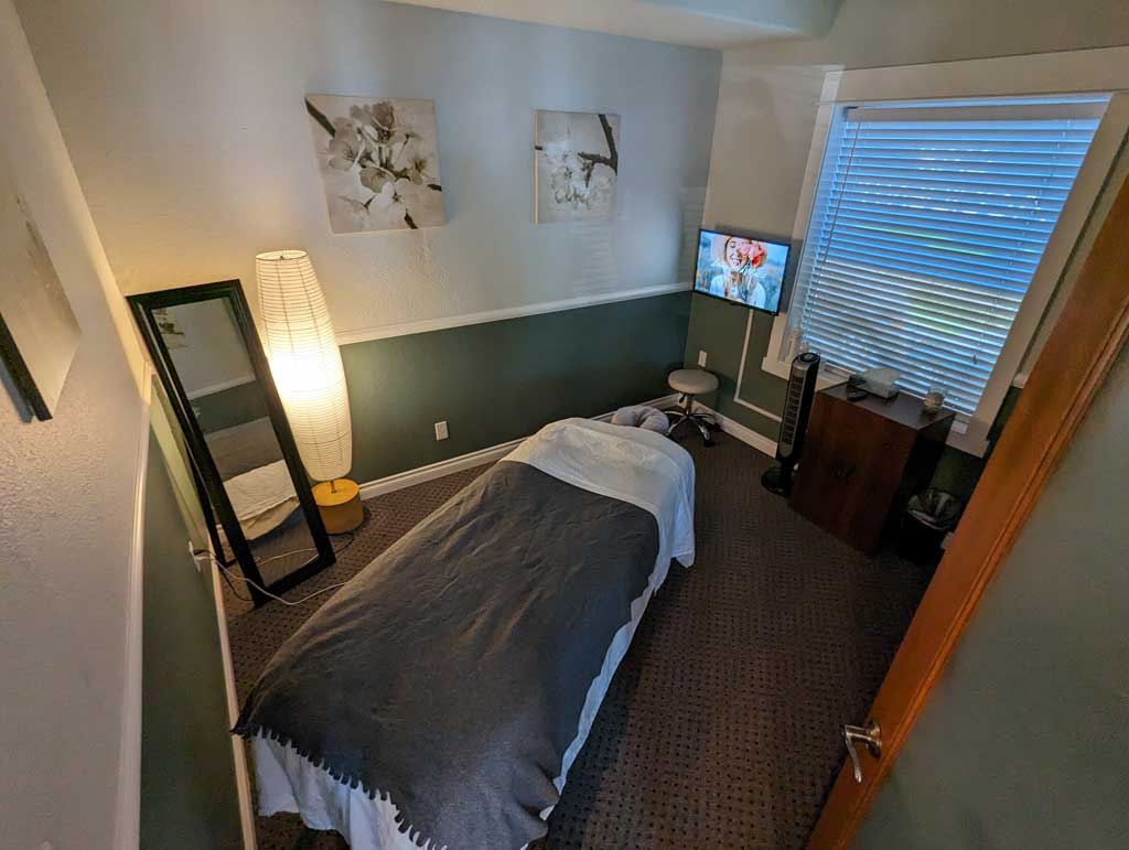 Gresham Clinic massage room with massage table.