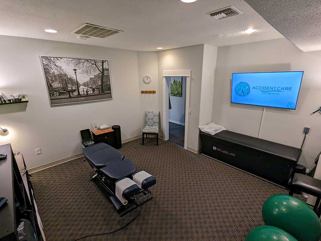 Larger view of Gresham Clinic treatment room with chiropractor table.