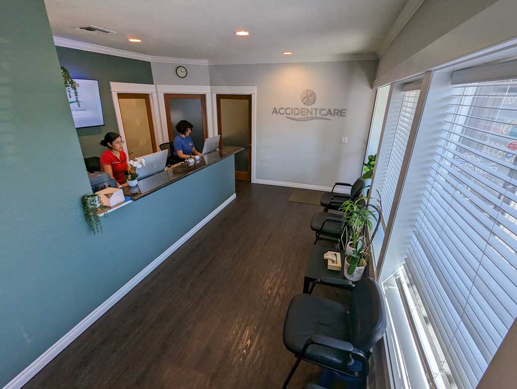 Alternate angle of front desk with workers at Gresham Chiropractor Clinic.