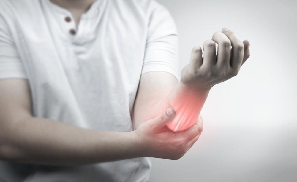 Man experiencing a burning sensation in his arm.