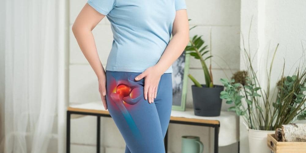 Young woman experiences hip pain from pelvic tilt.