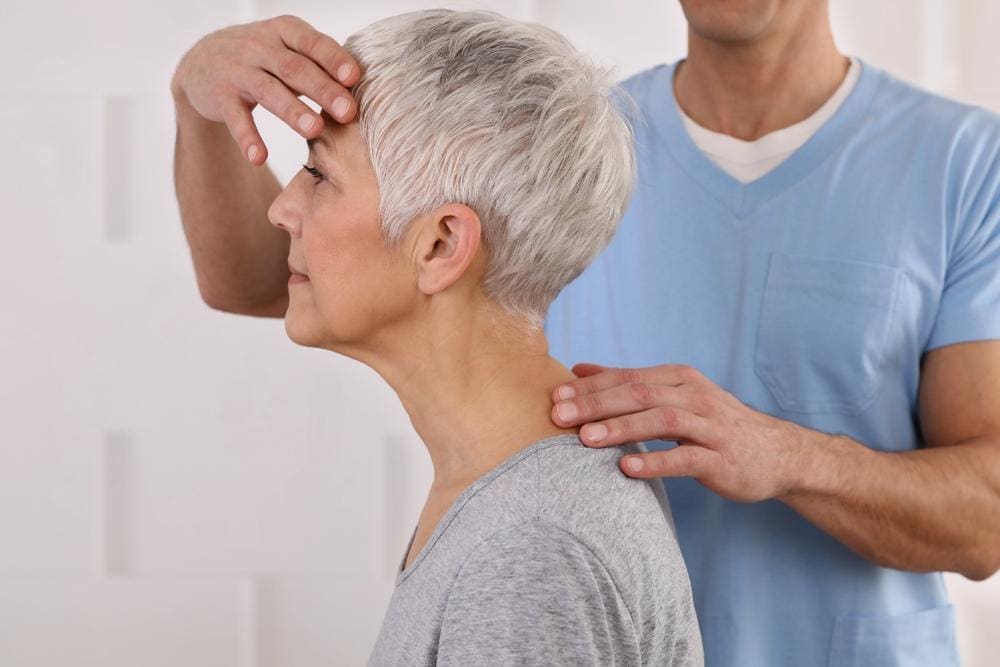 chiropractor treating MS patient.