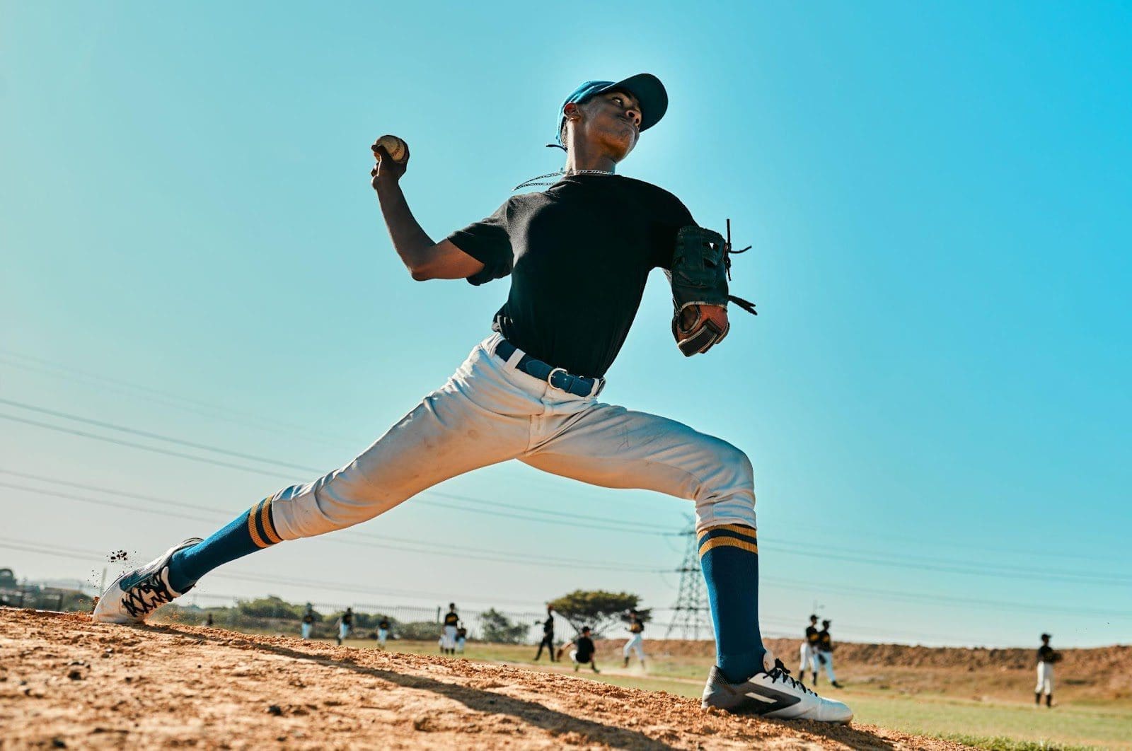 Young baseball pitcher throwing a ball.