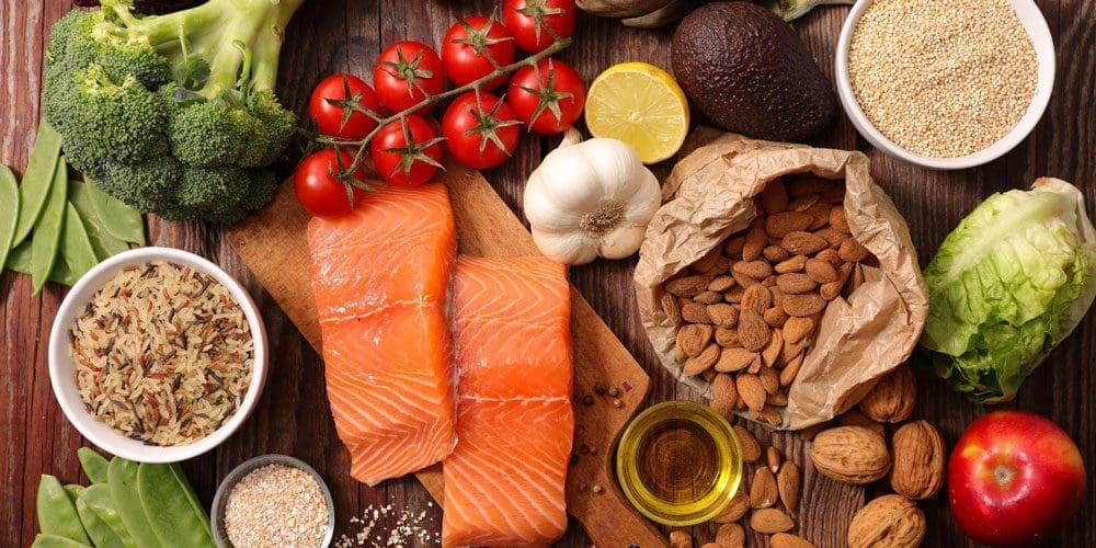 Selection of healthy food on a wooden cutting board.