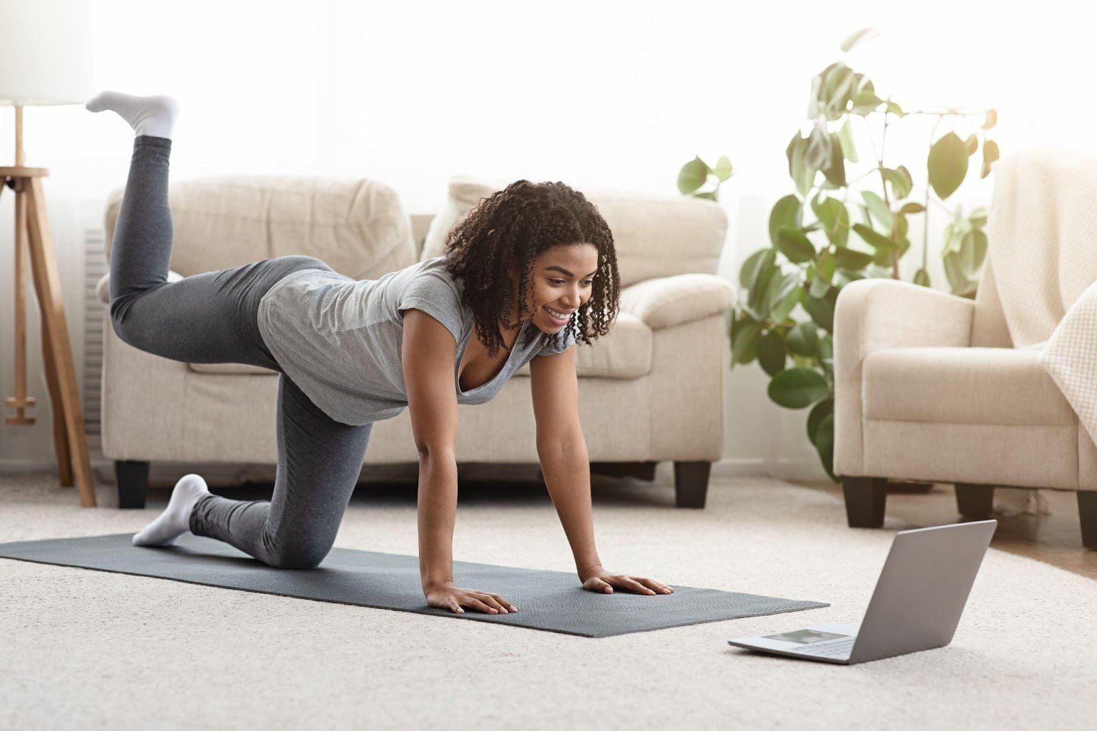 Young woman doing yoga at home.