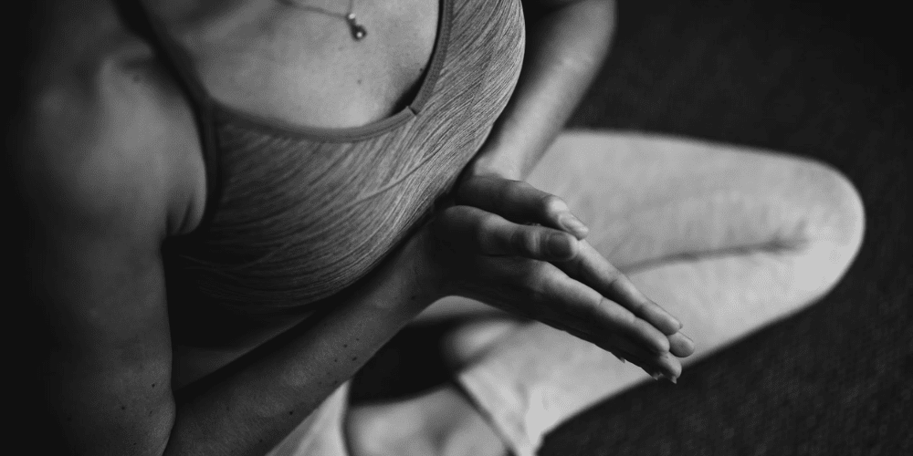 A women doing yoga trying to relieve stress.
