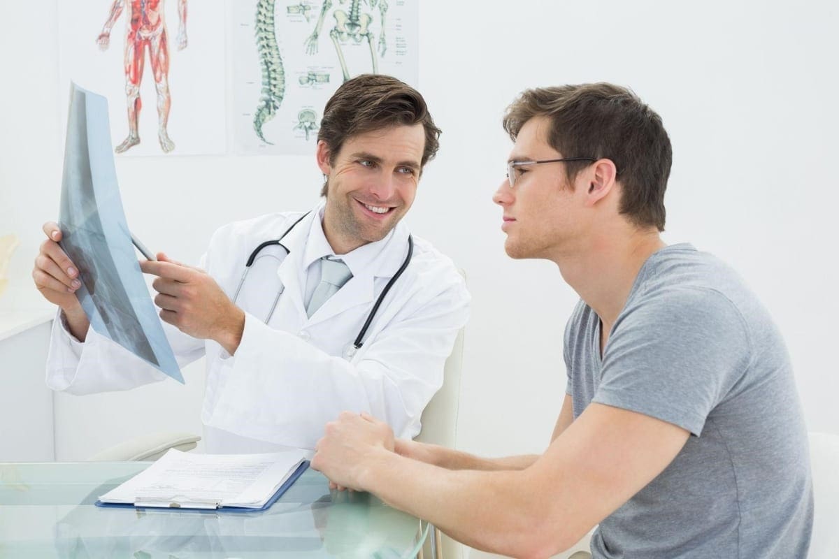 A chiropractor discusses options with a patient.