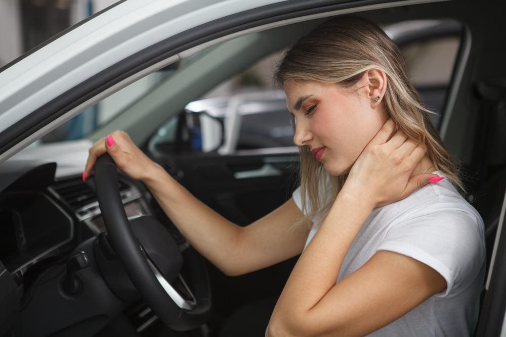 A woman who was just in a car accident, is experiencing head pain.
