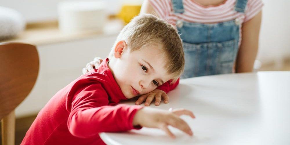 A young child is ignoring his caretaker because he struggles ADHD.