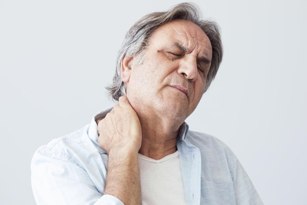 A man is experiencing pain from degenerative arthritis in the neck. 