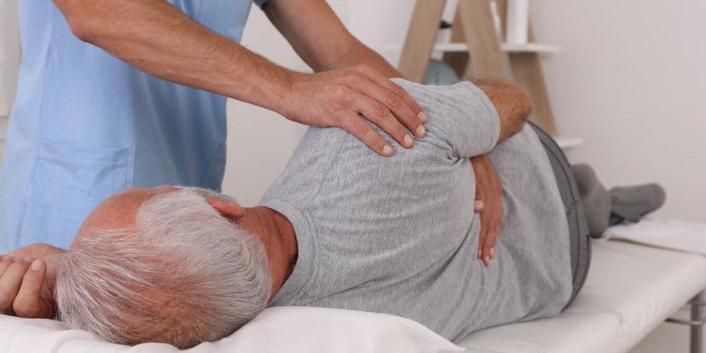 Chiropractor working on a patient's back.
